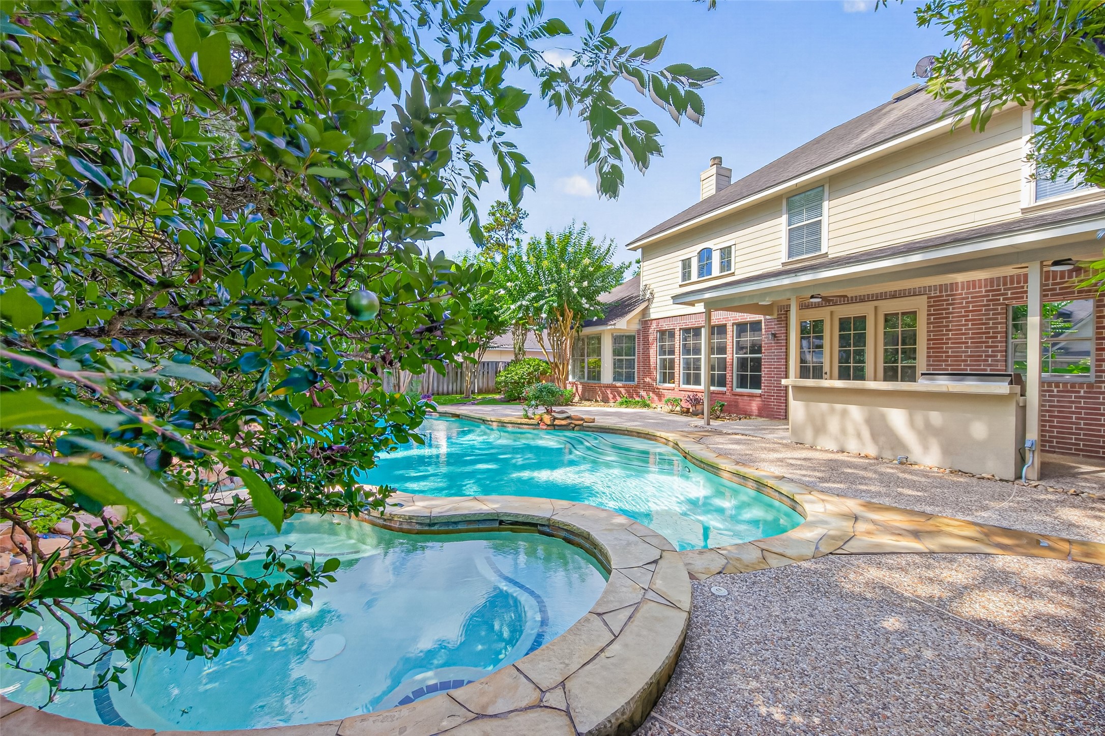 10 Mirror Ridge Drive The Woodlands, TX 77382 - Photo 42 of 48 Imagine summer days by the swimming pool, serving drinks from the outdoor kitchen