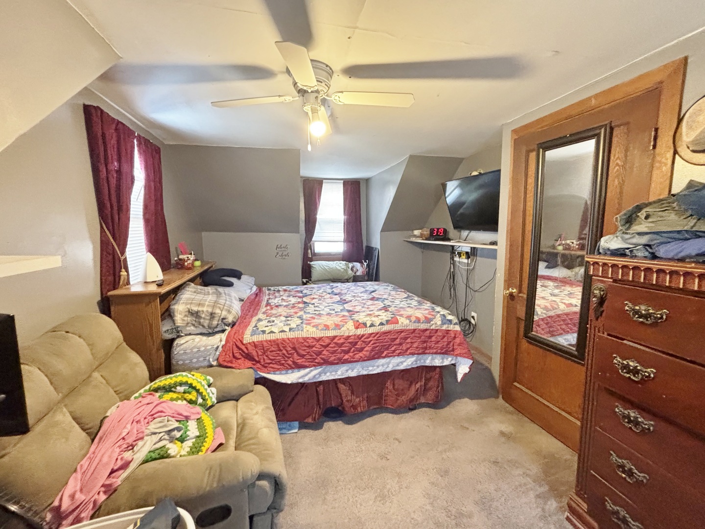 751 21st Street East Moline, IL 61244 - Photo 9 of 21 a bedroom with two beds and a chandelier