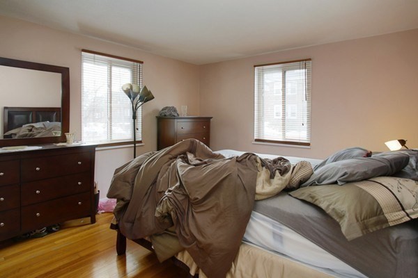 71 Colborne Road, Unit 1B Boston, MA 02135 - Photo 4 of 7 a bedroom with a bed and a window