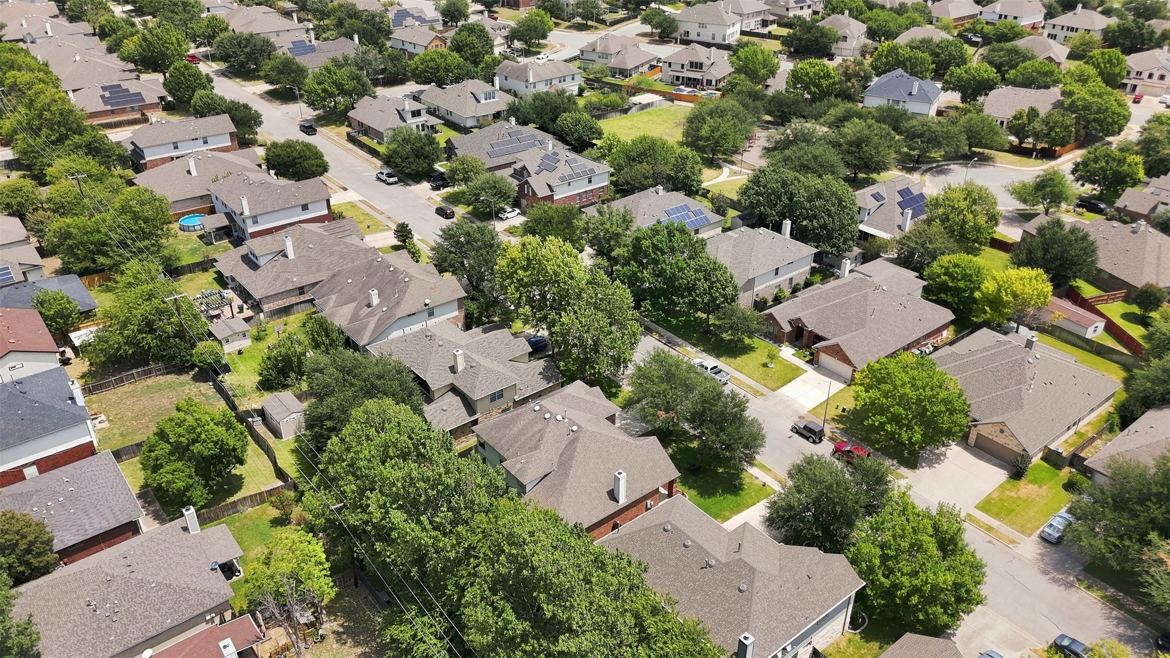 1116 Canyon Maple Road Pflugerville, TX 78660 - Photo 29 of 32 Mature trees line the streets of this established residential neighborhood.