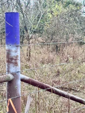 a view of balcony with wooden floor and fence