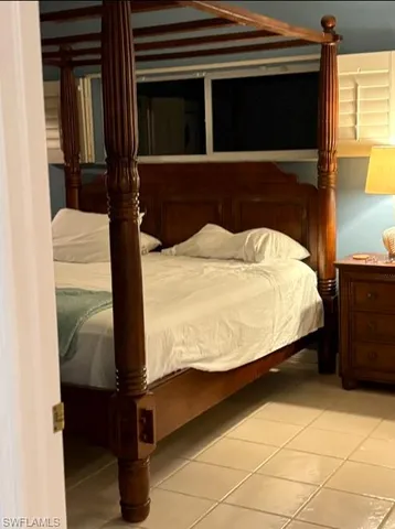 a bathroom with a granite countertop sink a mirror and shower