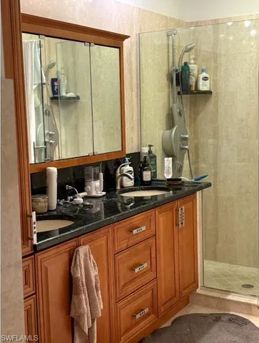 a bathroom with a white toilet and a shower curtain