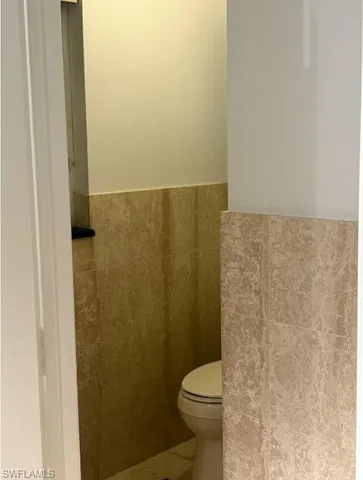 a bathroom with a toilet and a sink