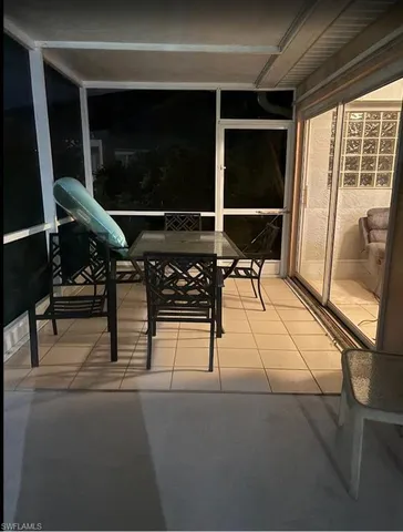 a view of a yard with table and chairs