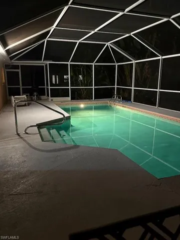 a view of a backyard with a floor to ceiling window