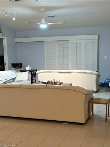 a living room with furniture and window