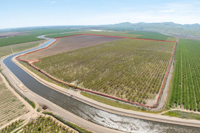 a view of a floor to ceiling window and an ocean view