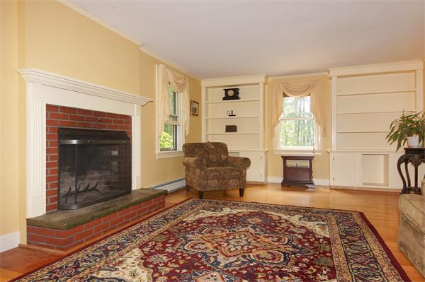30 Pinewood Road Bolton, MA 01740 - Photo 8 of 22 a living room with furniture and a fireplace