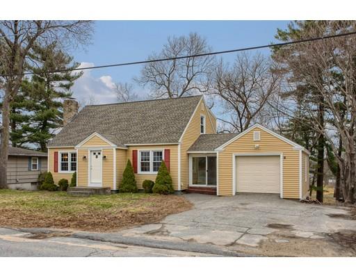 81 Sylvan Road Lancaster, MA 01523 - Photo 23 of 23 a front view of a house with a yard and garage