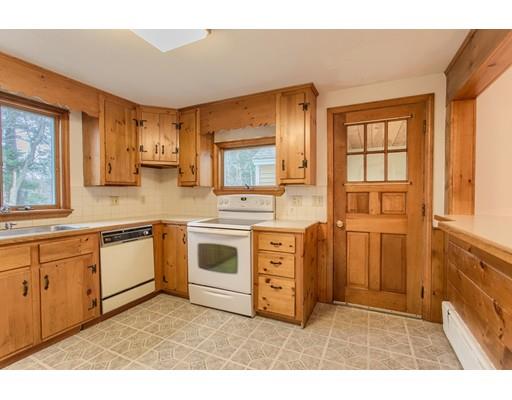 81 Sylvan Road Lancaster, MA 01523 - Photo 3 of 23 a kitchen with stainless steel appliances granite countertop a stove a sink and a refrigerator