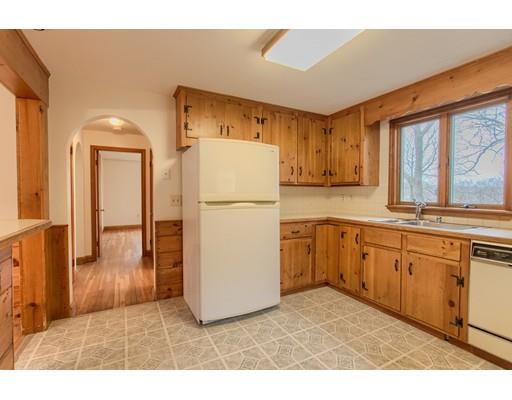 81 Sylvan Road Lancaster, MA 01523 - Photo 4 of 23 a kitchen with refrigerator cabinets and large window