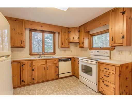 81 Sylvan Road Lancaster, MA 01523 - Photo 5 of 23 a kitchen with granite countertop a sink cabinets stainless steel appliances and a window