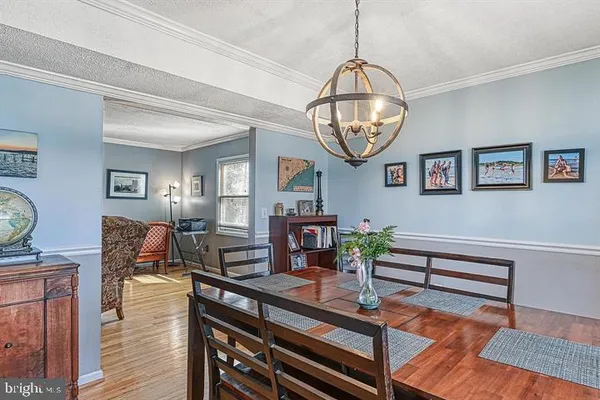 a view of dining room filled with furniture and wooden floor