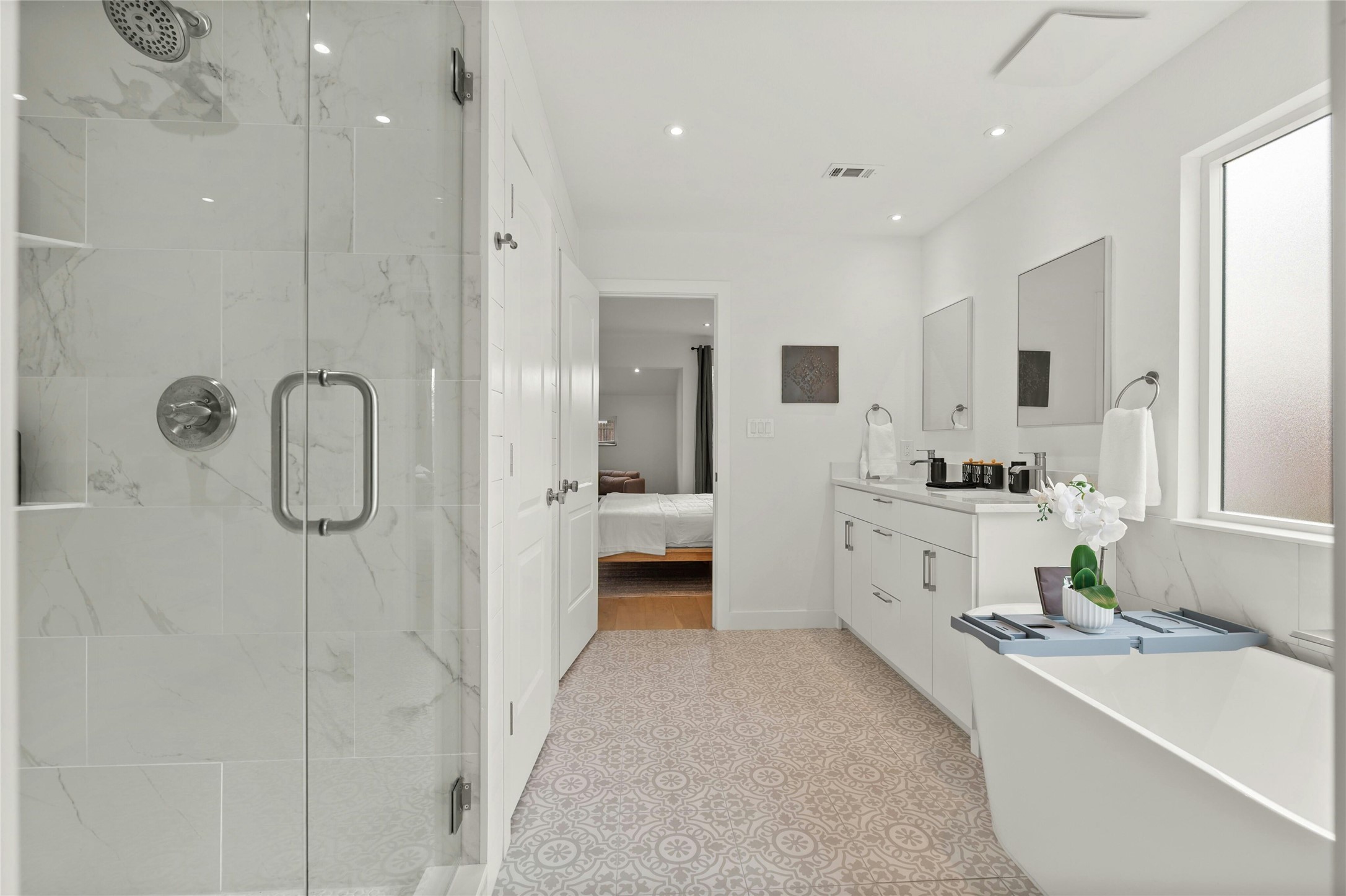 13207 Fencerail Road Manchaca, TX 78652 - Photo 12 of 36 Primary bathroom has a freestanding tub and a large walk in shower