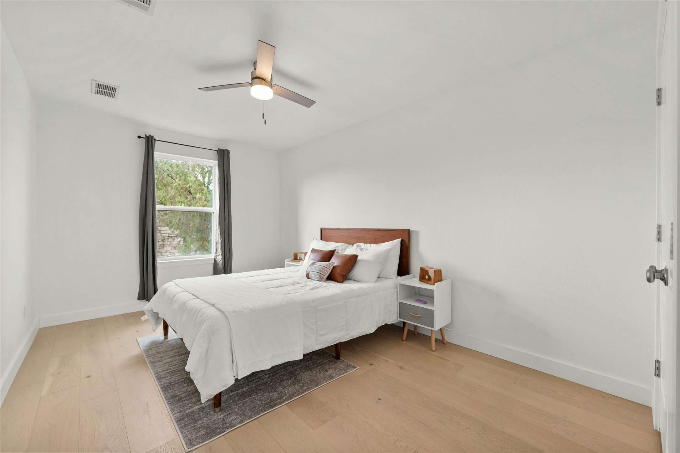 13207 Fencerail Road Manchaca, TX 78652 - Photo 22 of 36 Bedroom featuring white oak floors