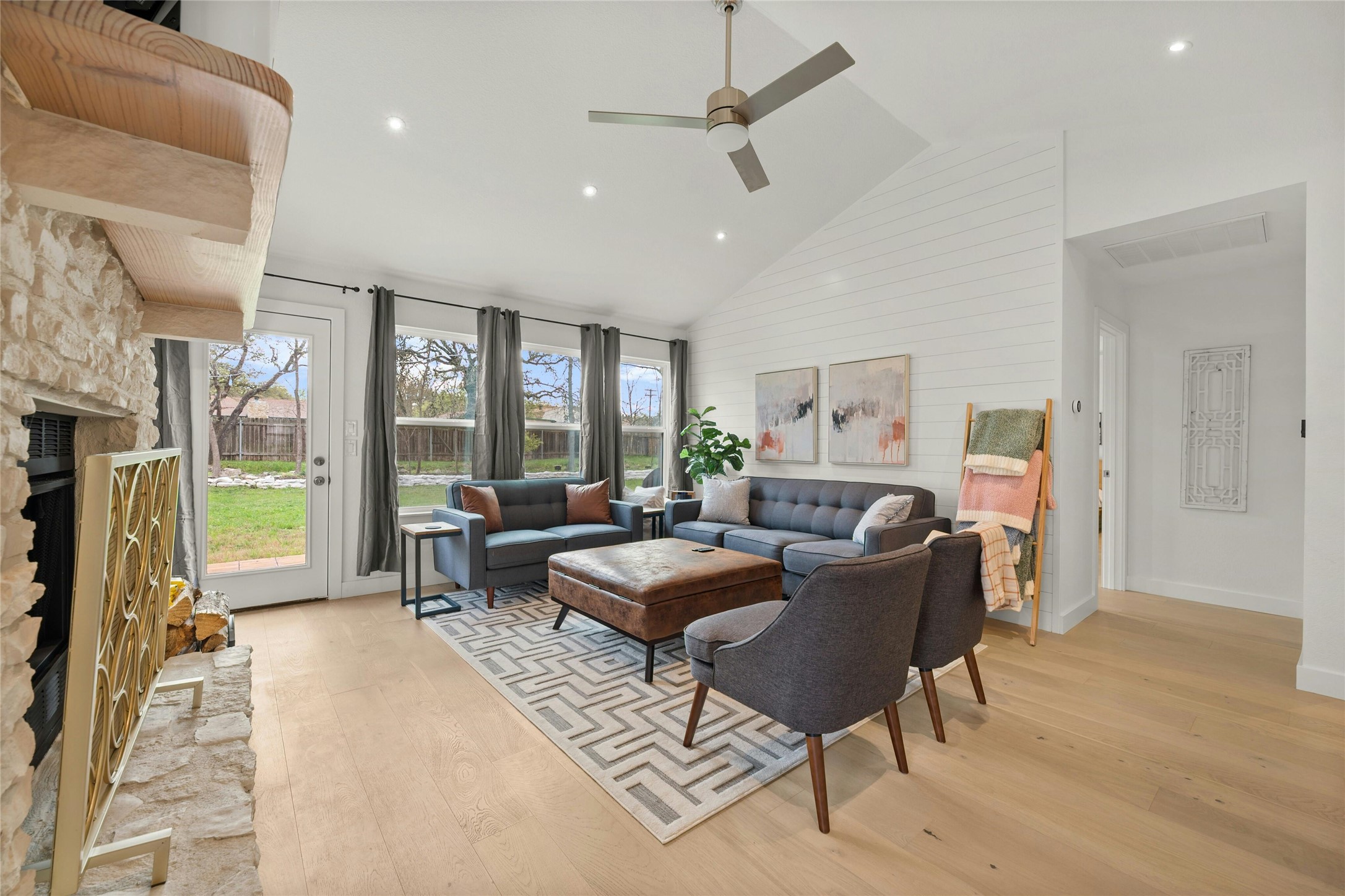 13207 Fencerail Road Manchaca, TX 78652 - Photo 7 of 36 The living area has a lot of natural light and recessed lighting with vaulted ceiling