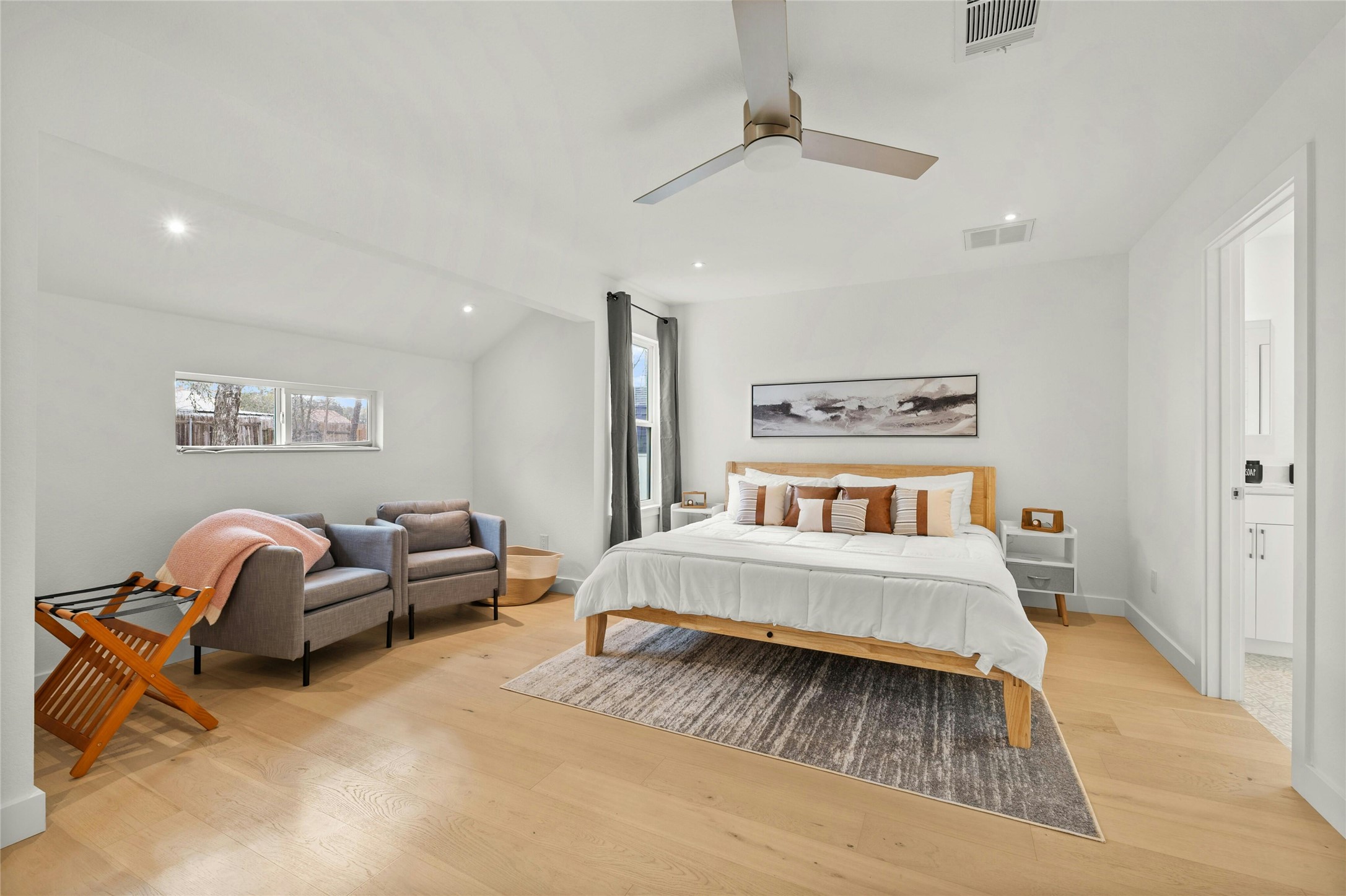 13207 Fencerail Road Manchaca, TX 78652 - Photo 8 of 36 The large primary bedroom has recessed lighting and a reading nook great for sitting or a cup of coffee in the morning