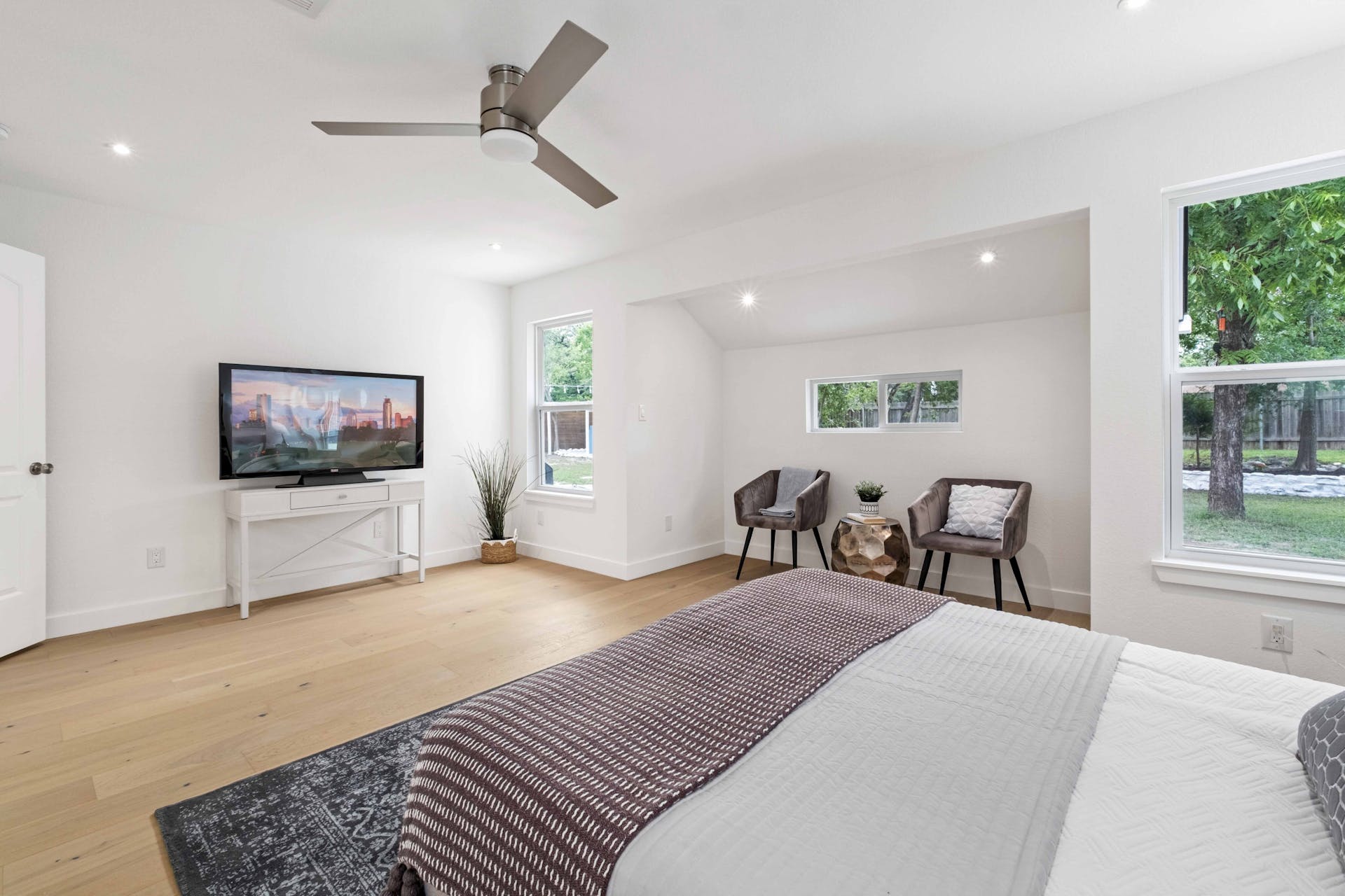 13207 Fencerail Road Manchaca, TX 78652 - Photo 9 of 36 The large primary bedroom has recessed lighting and a reading nook great for sitting or a cup of coffee in the morning