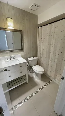 a view of a patio with a table and chairs