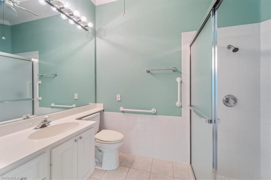3956 Isla Ciudad Court Naples, FL 34109 - Photo 20 of 31 a bathroom with a sink a toilet and shower