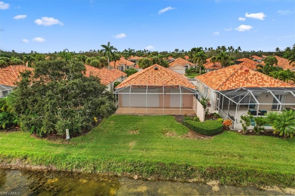 3956 Isla Ciudad Court Naples, FL 34109 - Photo 30 of 31 a view of a house with a big yard