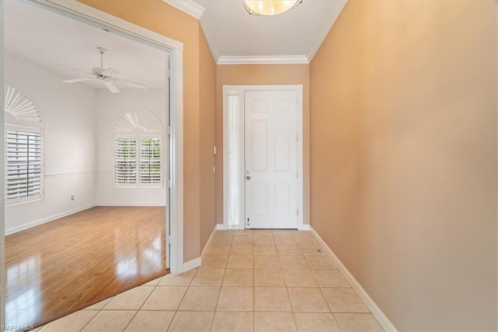 3956 Isla Ciudad Court Naples, FL 34109 - Photo 4 of 31 a view of an empty room with closet and a window