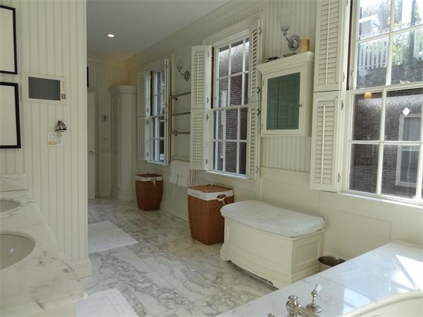 51 Chestnut Street Boston, MA 02108 - Photo 10 of 14 a bathroom with a granite countertop sink a toilet a shower and a mirror