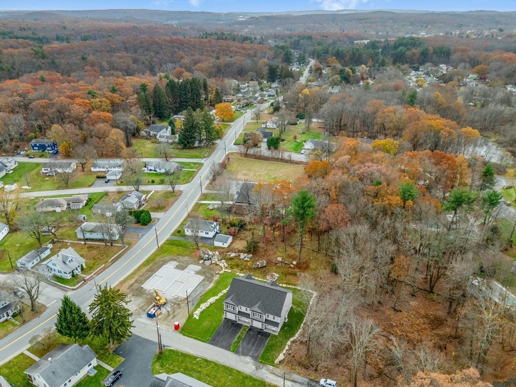 2 A Wilson Road, Unit A Millbury, MA 01527 - Photo 23 of 26 an aerial view of residential houses with outdoor space and trees