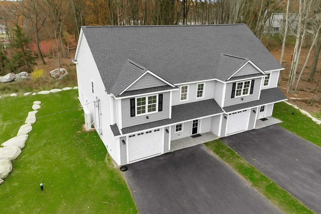 2 A Wilson Road, Unit A Millbury, MA 01527 - Photo 3 of 26 a aerial view of a house with a yard
