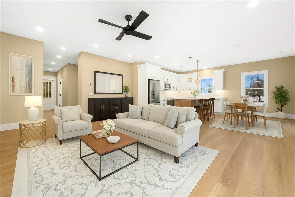 2 A Wilson Road, Unit A Millbury, MA 01527 - Photo 9 of 26 a living room with furniture and a large window
