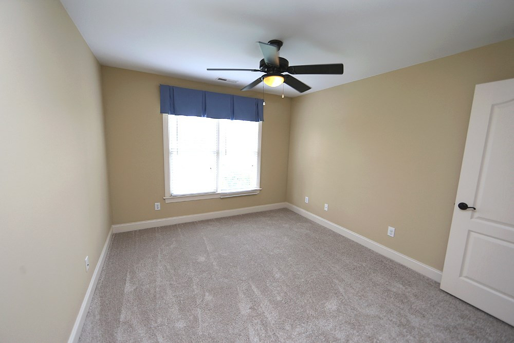 637 Competition Road Raleigh, NC 27603 - Photo 23 of 30 The second of three upstairs bedrooms. Ceiling fans in all the bedrooms is an added bonus. 3rd Bedroom