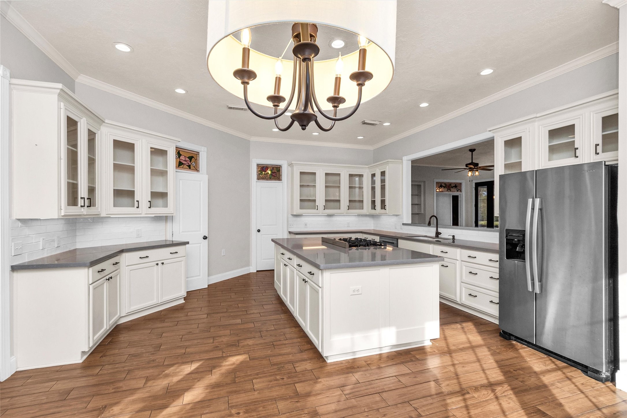 1548 Virgie Community Road Magnolia, TX 77354 - Photo 19 of 50 a kitchen with stainless steel appliances granite countertop a stove and cabinets