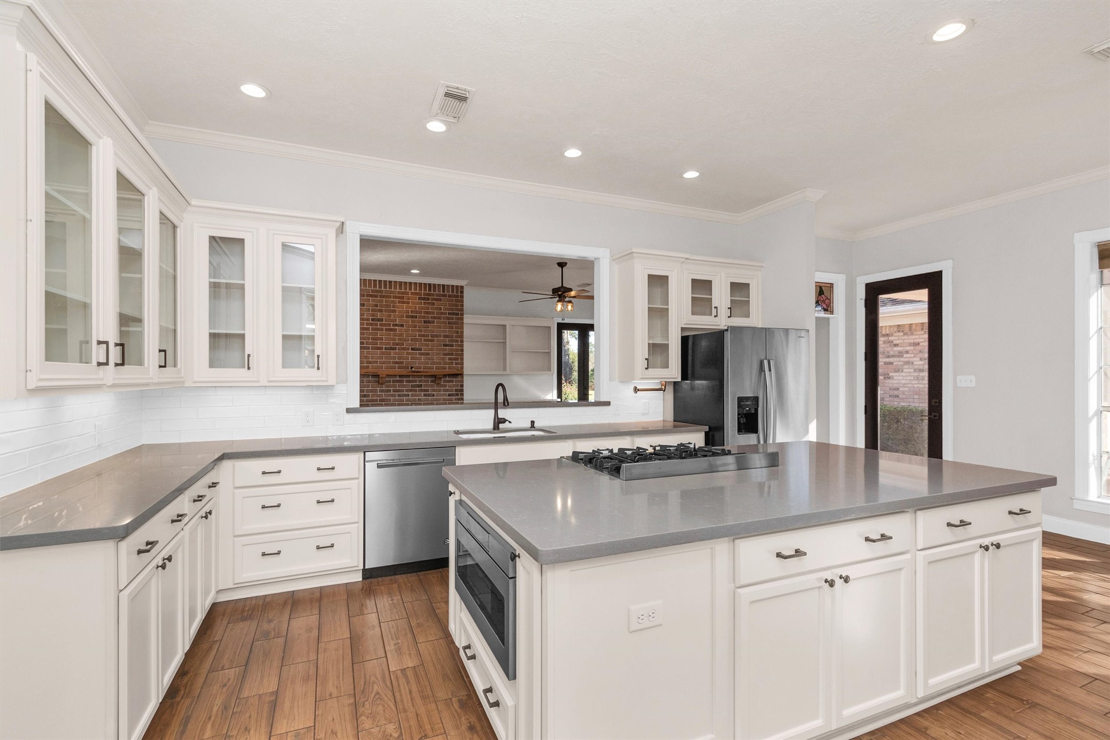 1548 Virgie Community Road Magnolia, TX 77354 - Photo 21 of 50 a kitchen with stainless steel appliances granite countertop a sink stove and refrigerator