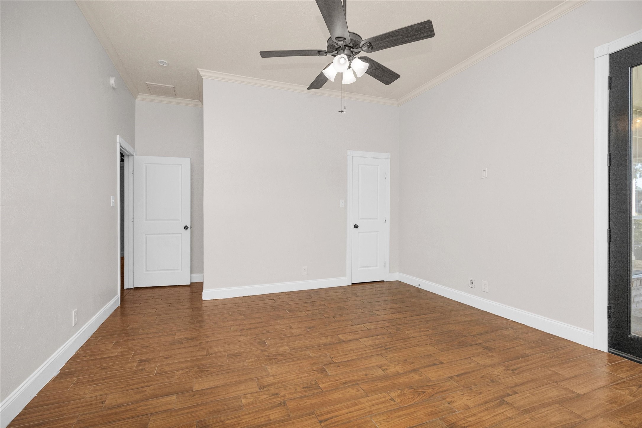 1548 Virgie Community Road Magnolia, TX 77354 - Photo 27 of 50 an empty room with a fan & a ceiling fan