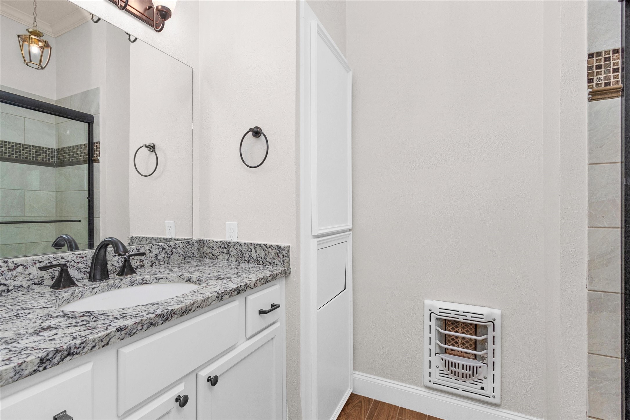 1548 Virgie Community Road Magnolia, TX 77354 - Photo 28 of 50 a bathroom with a granite countertop sink and a mirror
