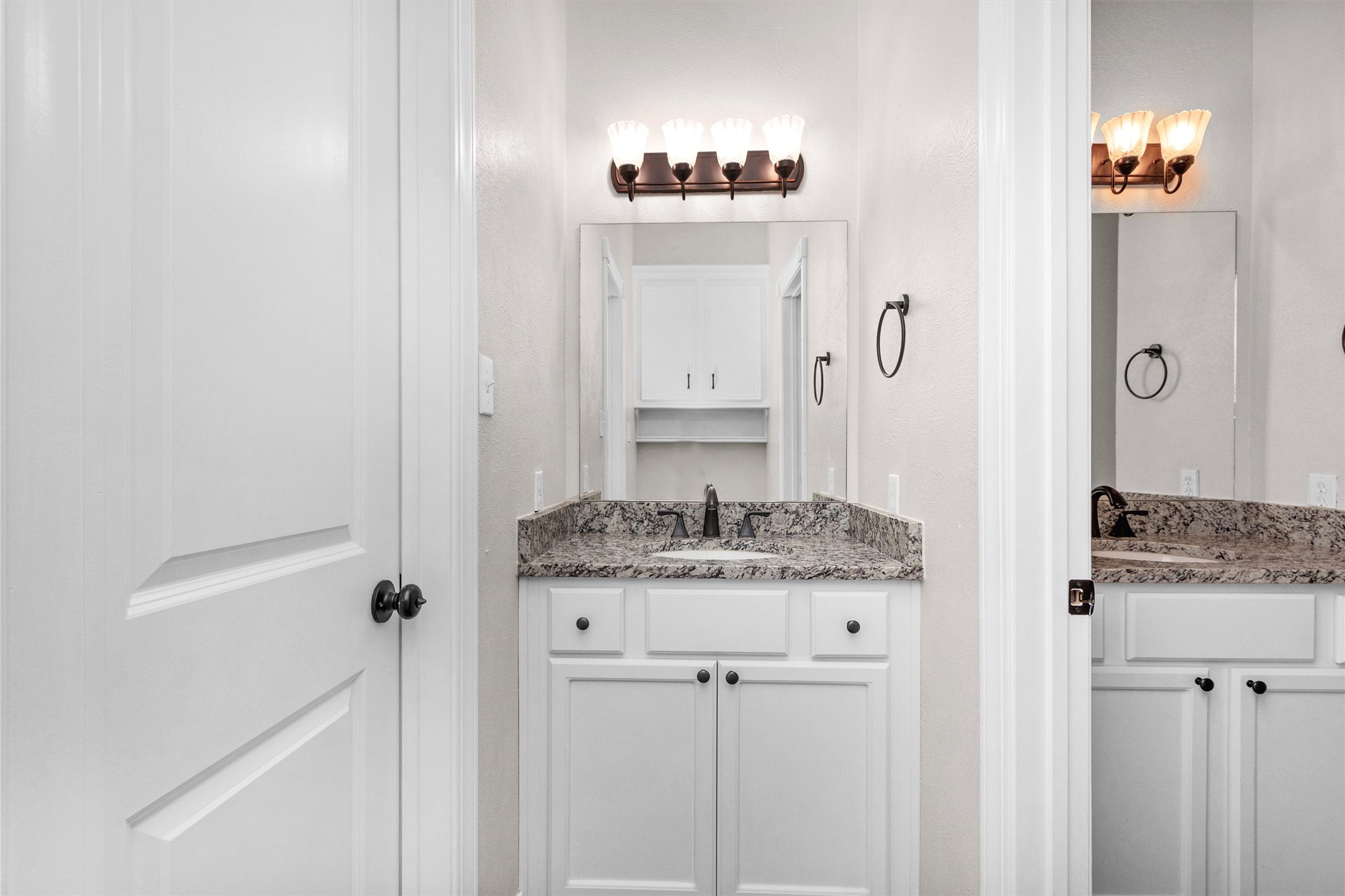 1548 Virgie Community Road Magnolia, TX 77354 - Photo 29 of 50 a bathroom with a granite countertop sink a mirror and a shower