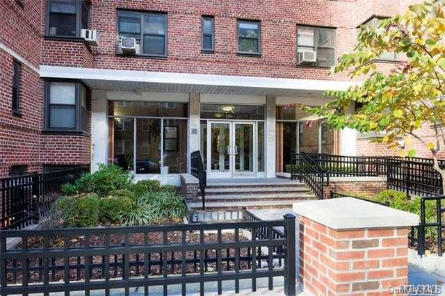 109-23 71st Road, Unit 1B Queens, NY 11375 - Photo 1 of 1 front view of a house with a porch