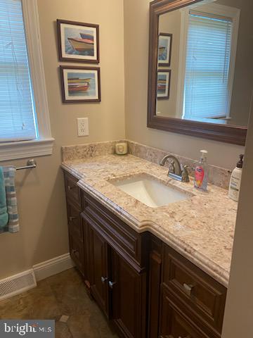 205 Rose Street Lock Haven, PA 17745 - Photo 13 of 24 a bathroom with a granite countertop sink and a mirror