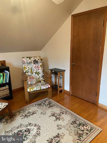 205 Rose Street Lock Haven, PA 17745 - Photo 15 of 24 a view of a livingroom with wooden floor and a bed