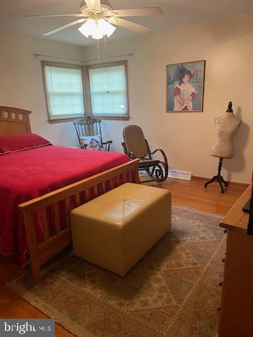 205 Rose Street Lock Haven, PA 17745 - Photo 18 of 24 a bedroom with a bed and a chandelier