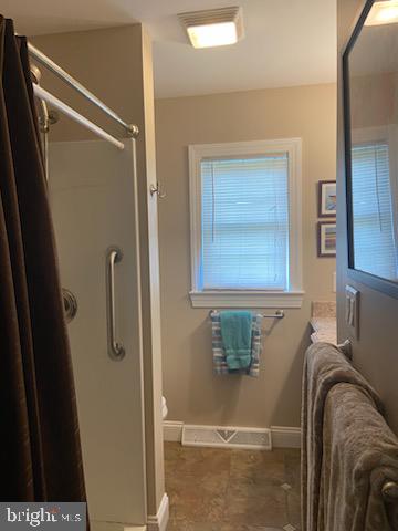 205 Rose Street Lock Haven, PA 17745 - Photo 21 of 25 a bathroom with a window sink and shower