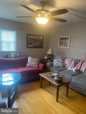a living room with furniture and a rug