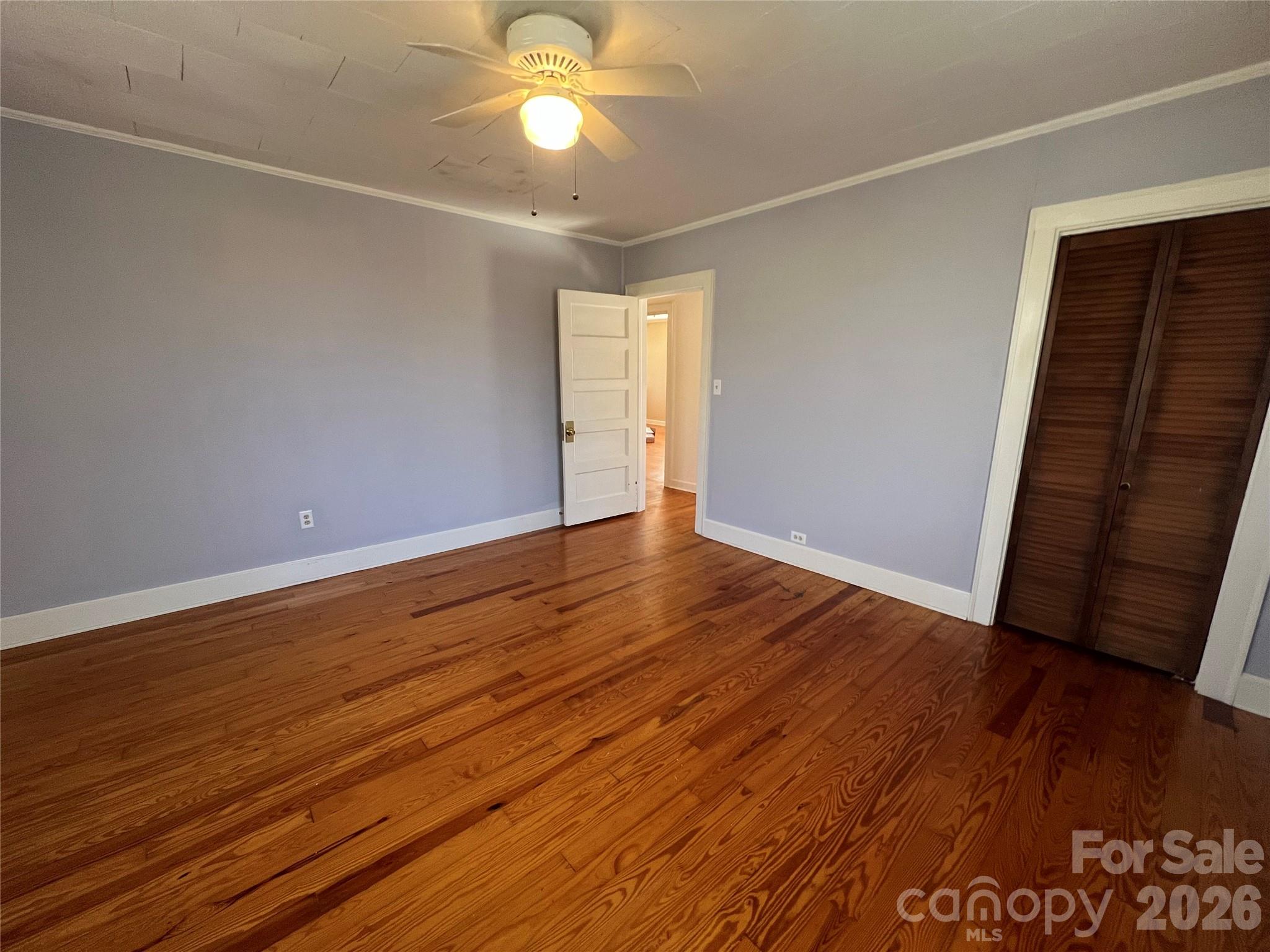 651 Still Street Chester, SC 29706 - Photo 17 of 30 an empty room with wooden floor and windows