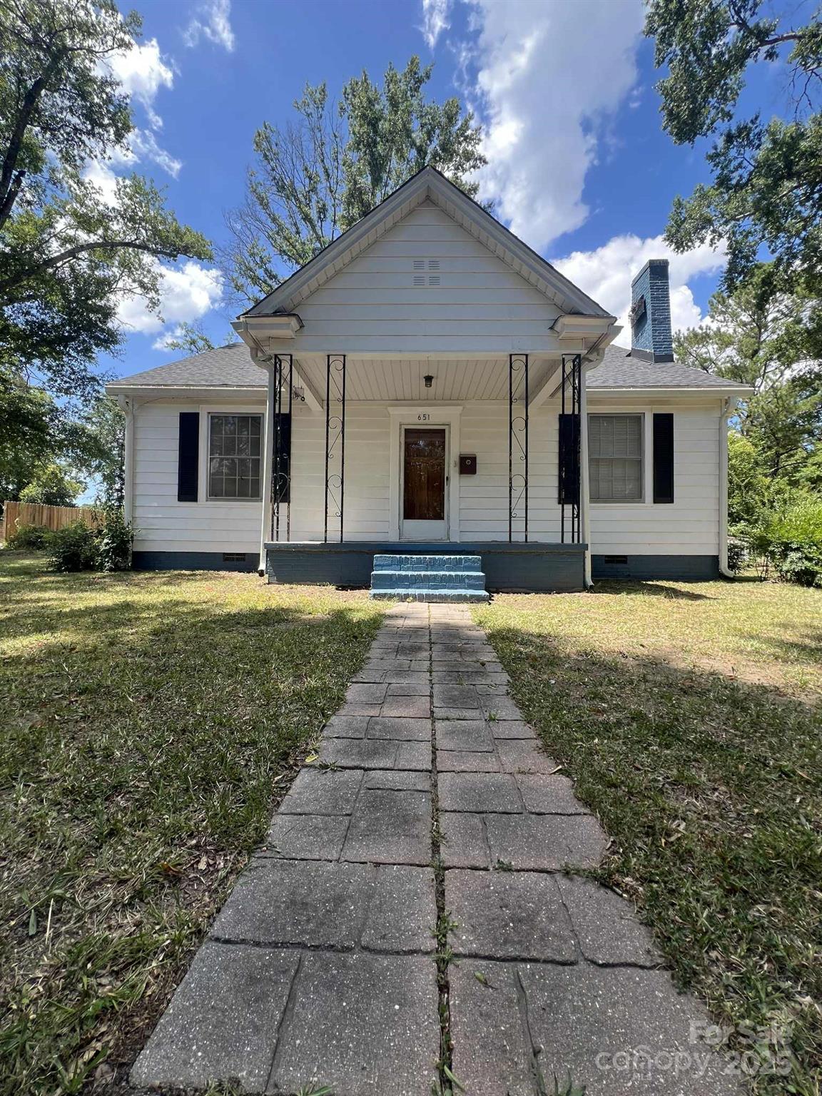 651 Still Street Chester, SC 29706 - Photo 2 of 27 a front view of a house with yard and outdoor seating