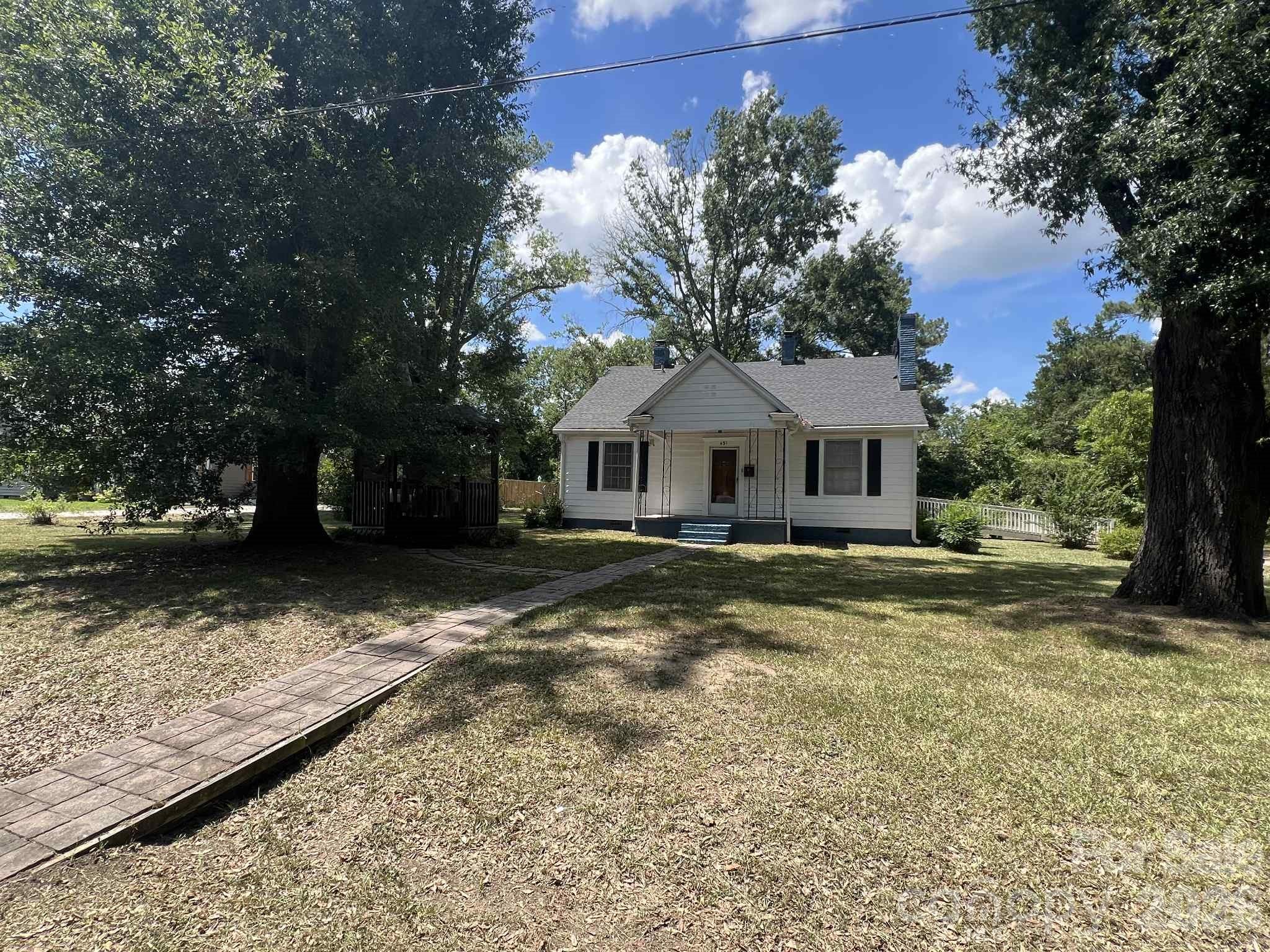 651 Still Street Chester, SC 29706 - Photo 2 of 30 a front view of a house with garden