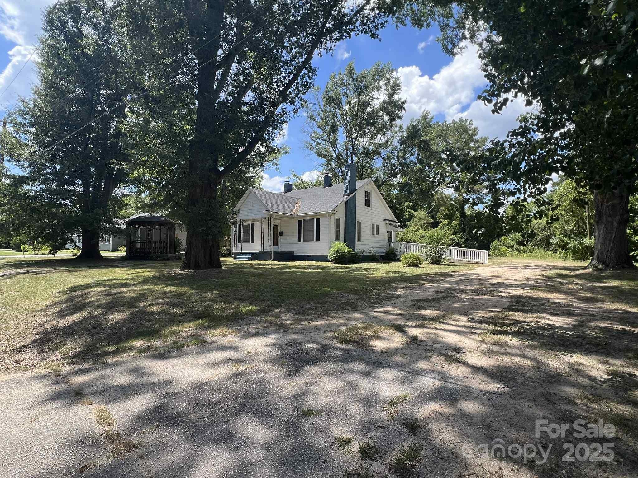 651 Still Street Chester, SC 29706 - Photo 3 of 27 a front view of a house with a yard