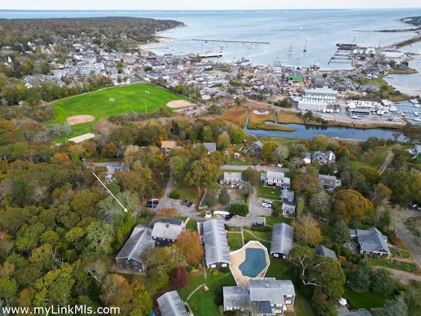an aerial view of residential houses with outdoor space