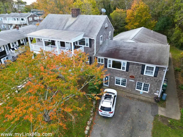 a aerial view of a house with swimming pool and sitting space