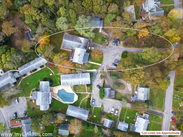 an aerial view of houses with outdoor space